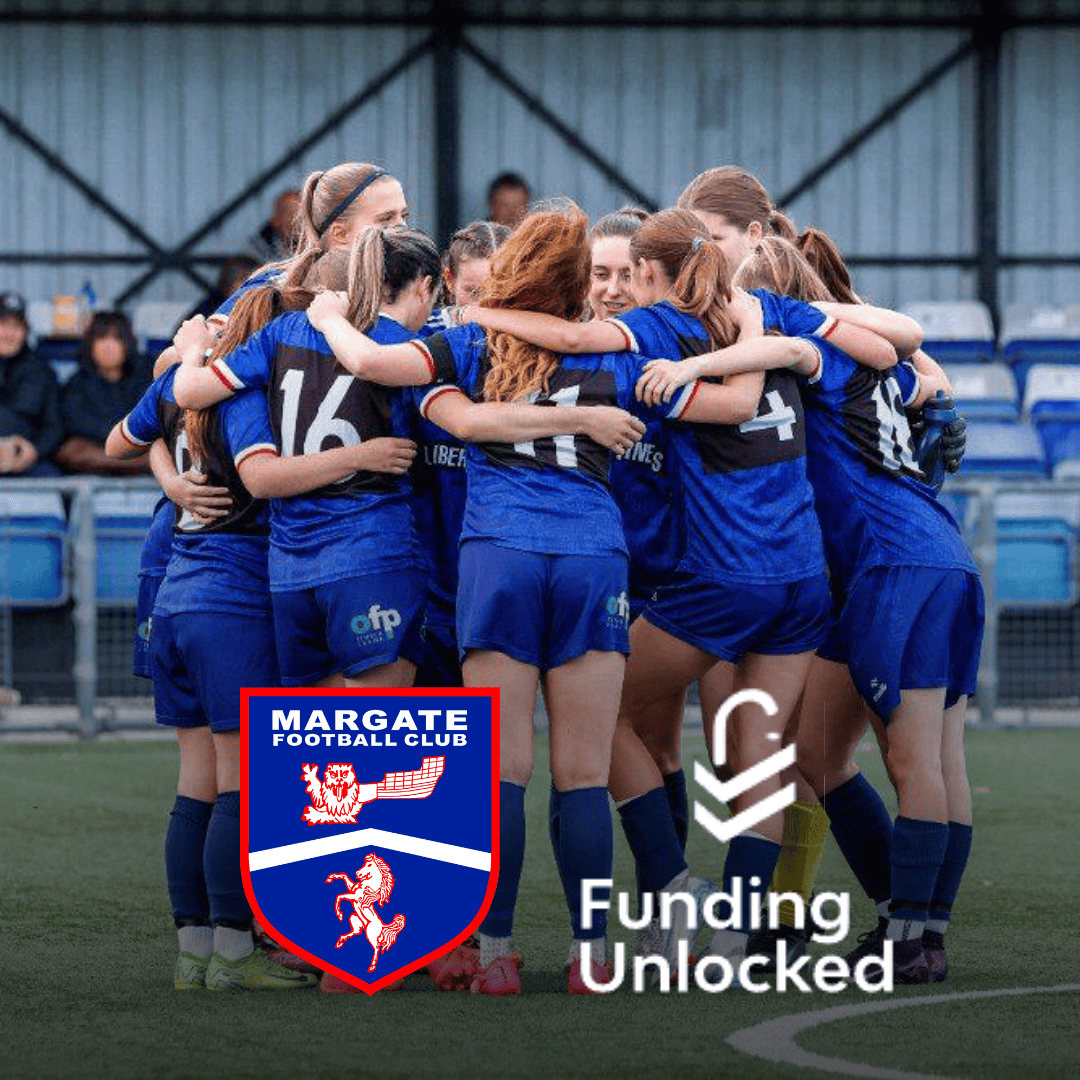A close-up image of the Margate Women's Football Club squad in a celebratory huddle on the pitch, all wearing their blue and black kit. The Margate Football Club crest and the "Funding Unlocked" logo are overlaid on the image, representing the new grassroots sponsorship deal announced by Sponsor Seeker.